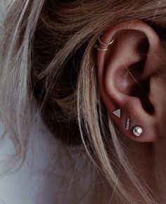 a woman with ear piercings on her ears