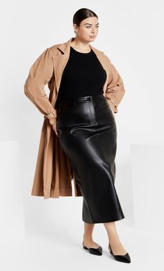 Level up your look with the fashion-forward Faux Leather Ivy Skirt. Boasting a midi length and back slit hem, this skirt is made for gorgeous ensembles. Polished with a front button and zip closure, revel in the confidence this skirt brings. Key Features Include: - Front button and zip closure - Belt loops - Faux leather stretch fabrication - Midi length - Back slit hemline Team with a ribbed tank top and bold necklace for a chic look. | Plus Size Faux Leather Ivy Skirt in Black, Size 18 | City Faux Leather Skirt Outfit, All Black Outfits For Women, Elevated Essentials, Leather Skirt Outfit, Look Plus Size, Bold Necklace, Leather Jacket Outfits, Ribbed Tank Top, All Black Outfit