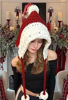 a woman wearing a red and white knitted hat