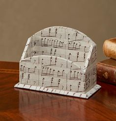 a music note box sitting on top of a wooden table