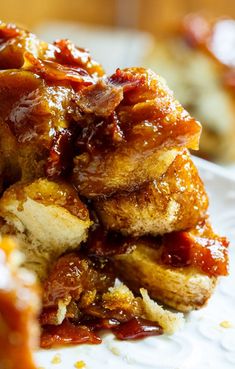 a close up of food on a plate with ketchup and sauce in the background