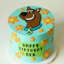 a birthday cake with a cartoon dog on it