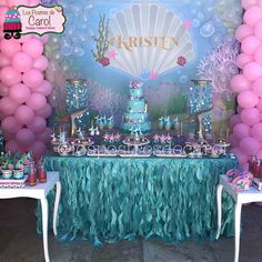 an under the sea themed birthday party with pink, blue and green decorations on tables