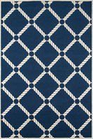 a blue and white rug with an intricate design