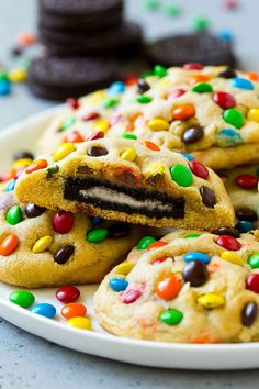 a plate full of cookies with chocolate chips and candy