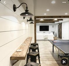 an indoor ping pong table in the middle of a room