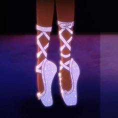 a pair of high heeled shoes with sparkles on them