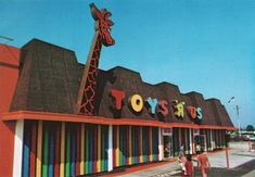 the front of a toy store with children playing outside