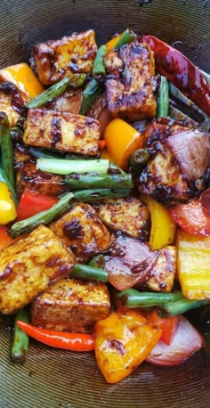 a bowl filled with meat and vegetables on top of a table