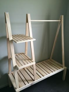 a wooden shelf sitting on top of a carpeted floor