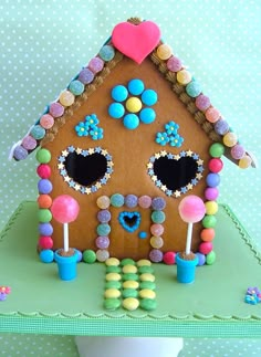 a gingerbread house with candy and candies on the roof is decorated like a child's house