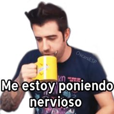 a man drinking out of a yellow cup with the words me estoy poniendo nerviroso on it