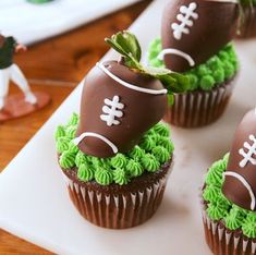 chocolate cupcakes with green frosting and football decorations