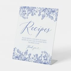 a blue and white floral recipe card with the word recipes written in cursive writing