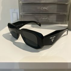 Prada Black Rectangle Sunglasses With Logo On Side And Comes With Case, Open To Offers :) Black Rectangular Sunglasses, Black Rectangle Sunglasses, Prada Rectangle Sunglasses, Luxury Black Square Sunglasses, Prada Square Sunglasses, Luxury Black Rectangular Shield Sunglasses, Prada Accessories, Black Rectangle, Rectangle Sunglasses