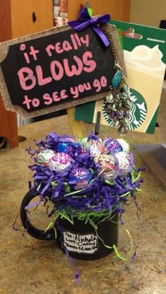 a starbucks coffee mug filled with candy and marshmallows