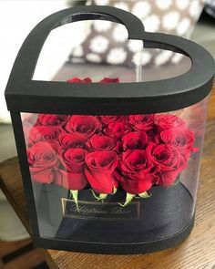 a black box with red roses in it