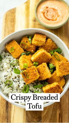 crispy breaded tofu served over rice in a bowl