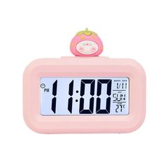 a pink alarm clock with a pig on it's top and the time displayed