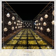 an image of a long hallway with lights on the sides and balls hanging from the ceiling