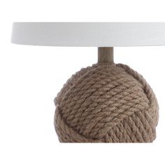 a lamp that is made out of rope and has a white shade on the top