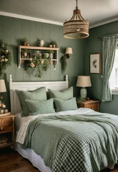 a bedroom with green walls and white bedding