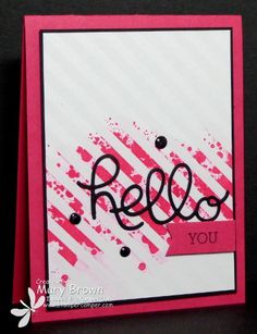 a close up of a card with the word hello on it and some ink splats