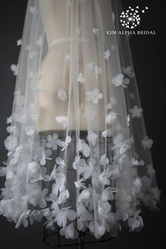 a veil with white flowers on it