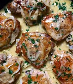 some chicken with sauce and onions in a pan