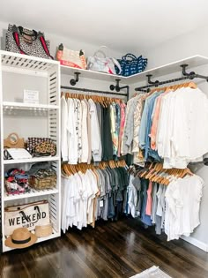 an organized closet with clothes and shoes