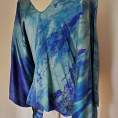 New Hand Painted Silk Caftan. One Of A Kind And Versatile For Casual Or Formal Occasions. This Will Fit Multiple Sizes. You Can Alter The Side Seam To Make It More Fitted If Desired. Easy Care, Machine Wash On Delicate, Cold Water Gentle Detergent Or Shampoo And Hang Dry. Camilla Style Beach Caftan Kaftan Top Coverup Travel Beach Resort Wear Runway Summer Holiday. Tie Dyed Green Blue Purple Navy Aqua Indigo Powder Blue Bohemian Designer Beach Party Or Lounge Wear Travel Boho Jetset Gypset Holida Blue Relaxed Fit V-neck Tunic, Blue Silk V-neck Kaftan, Blue Silk V-neck Blouse, Blue Relaxed Fit Tunic Blouse, Bohemian Blue Relaxed Fit Tunic, Blue Bohemian Hand Dyed Top, Blue Hand Dyed Bohemian Tops, Hand Dyed Blue Bohemian Tops, Bohemian Hand-dyed Blue Tops