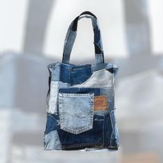 a bag made out of old jeans hanging from a hook