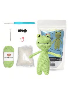 a crocheted frog is shown next to the kit for making a stuffed animal