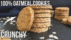 a stack of oatmeal cookies sitting on top of a black table next to other cookies