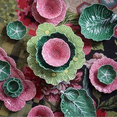 some green and pink flowers on a table