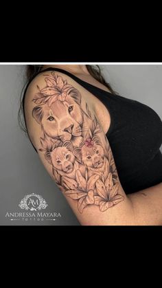 a woman with a lion and flowers tattoo on her arm, showing the breast area