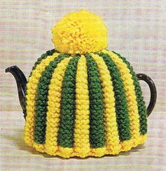 a knitted tea cosy with a yellow and green top