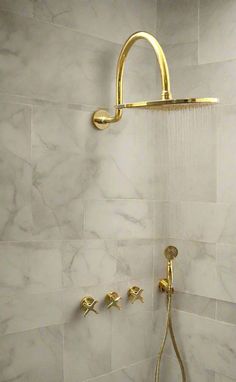 the shower head is gold in color