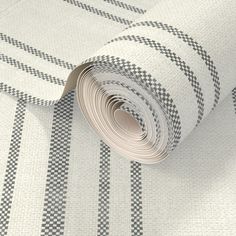 a roll of white and black checkered fabric