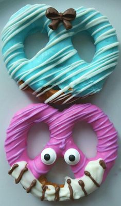 two doughnuts with eyes and mouths made to look like donuts