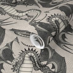 an image of a dragon wallpaper with black and white designs on the back ground