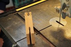 a piece of wood being cut with a machine