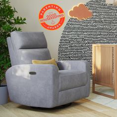 a grey recliner chair sitting in front of a wooden cabinet and wall with an orange sticker on it