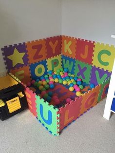 a child's play room with foam tiles and toys