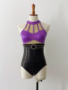 a female mannequin wearing a purple and black bodysuit