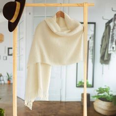 Add the delight of the Andes to your home with this shawl from Peru. Designed by Isidoro C'cahuantico the warm shawl is woven of soft 100% alpaca wool featuring a solid color in bone. Lovely fringes complete the shawl at each end. Italy 2023, Alpaca Shawl, Warm Shawl, Alpaca Yarn, Wool Shawl, Alpaca Wool, Traditional Techniques, Tshirts Online, Winter Scarf