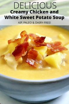 a bowl of creamy chicken and white sweet potato soup with bacon on top, in a blue bowl