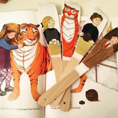 children's book with cut out pictures of people and animals on them, including a toothbrush