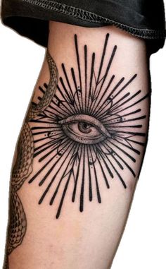 an all seeing eye tattoo on the leg