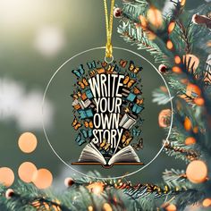 an ornament hanging from a christmas tree with the words write your own story